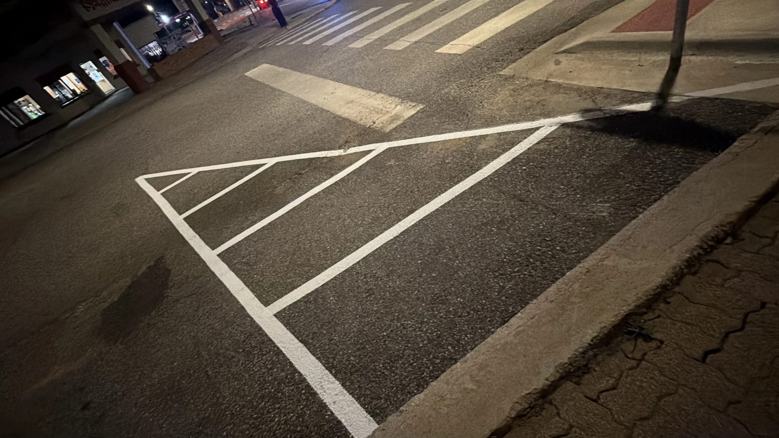 Crisp crosswalk and directional pavement markings on asphalt