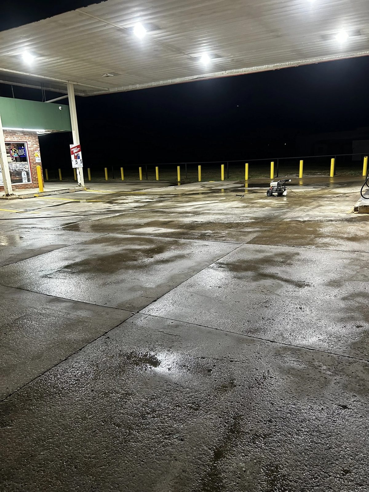 Gas station forecourt pressure washed at night by The Lot Doctor