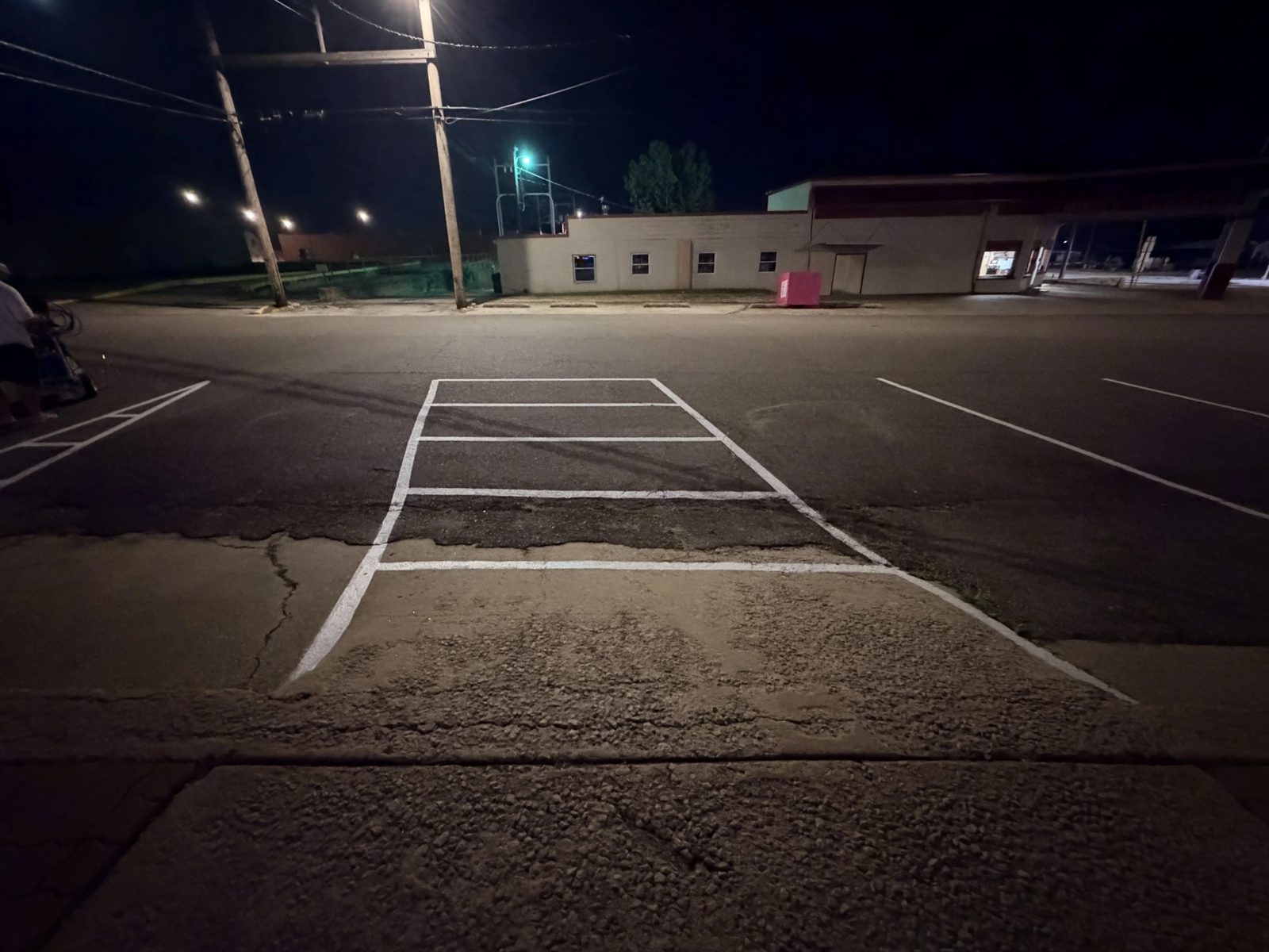 Newly striped commercial parking lot at night by The Lot Doctor