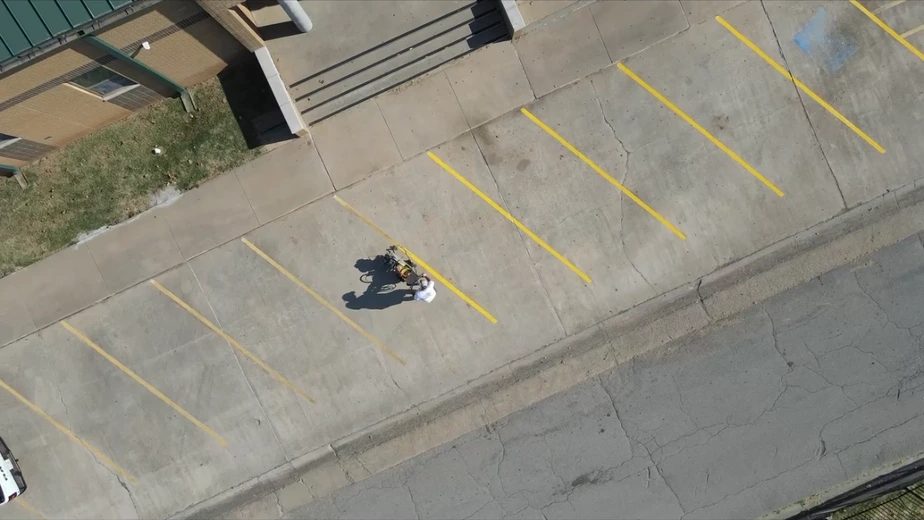 Aerial drone view of The Lot Doctor striping a commercial parking lot